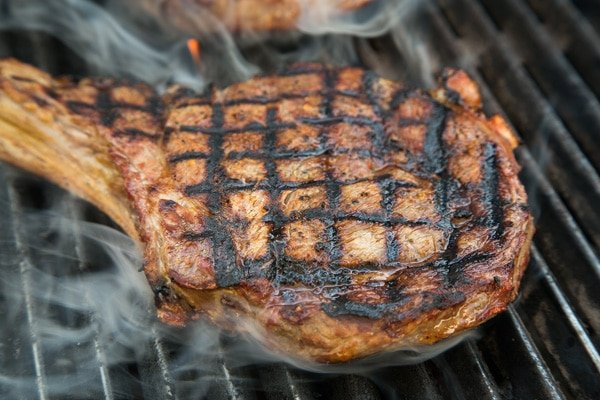 A ribeye steak on the grill